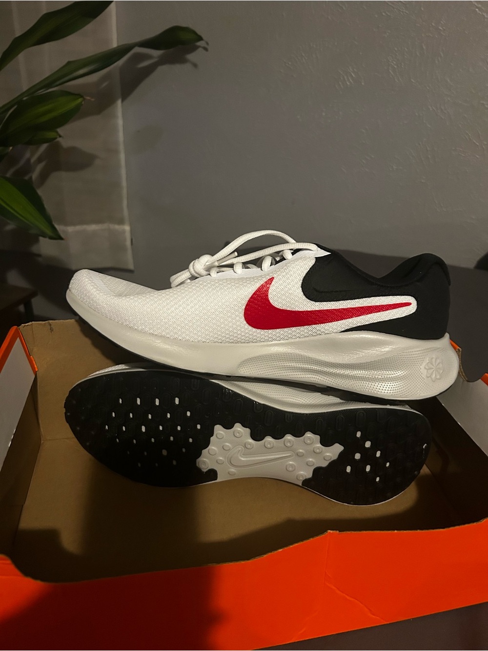 Men’s Nike White Sneakers with Red Swoosh and Black Accents